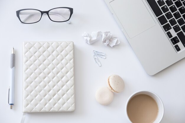 Top view of a working desk with lady office supplies