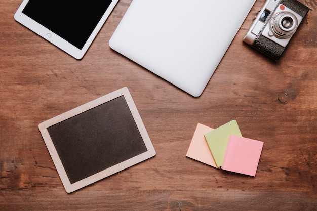 Free Photo top view of workspace with slate and post its