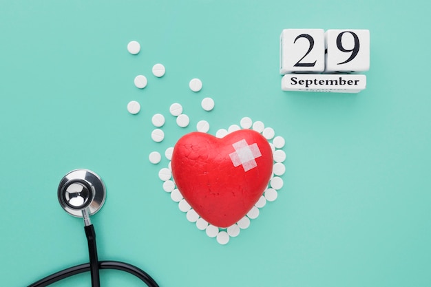 Free Photo top view world heart day concept with stethoscope