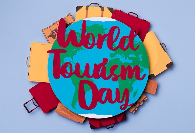 Free photo top view world tourism day with lettering