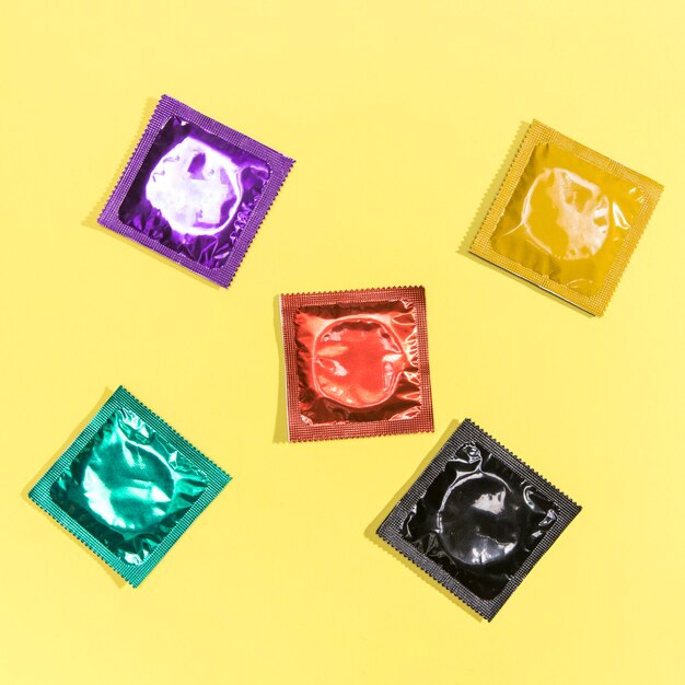 Top view wrapped colourful condoms