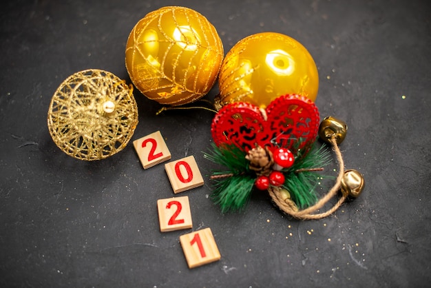 Top view xmas hanging ornaments wood block on dark surface