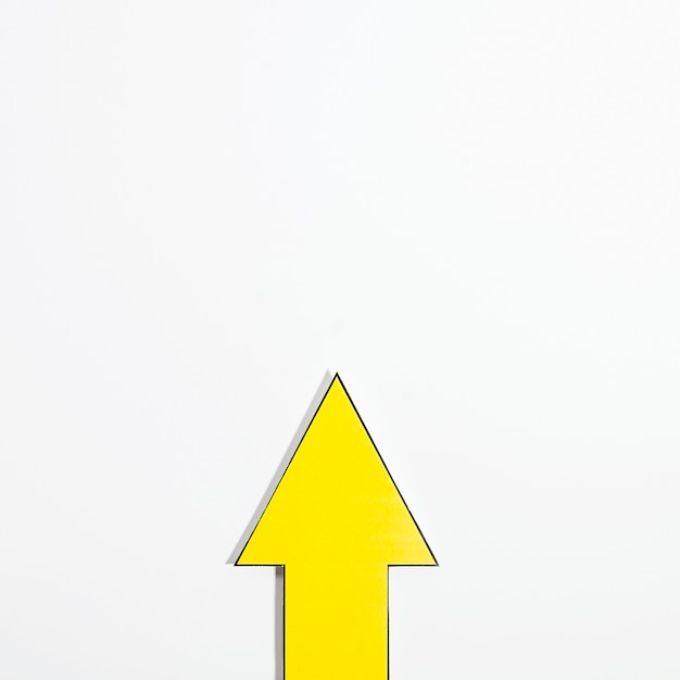 Top view of yellow arrow with copy space