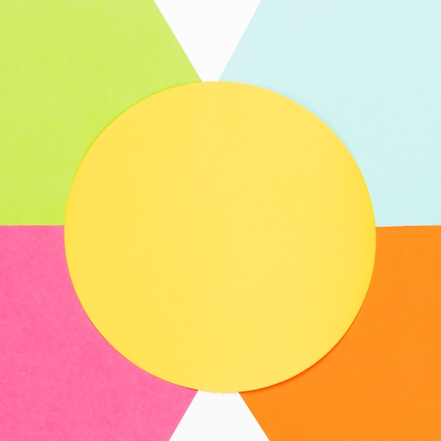 Free Photo top view yellow circle with colorful geometric shapes