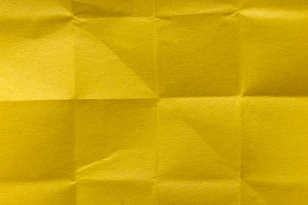 Top view yellow crumpled paper