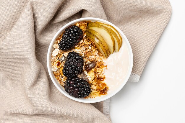 Top view yogurt with oats, fruits and honey