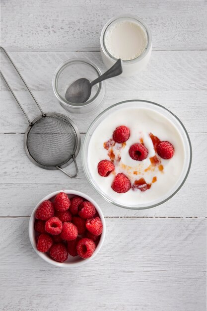 Top view yogurt with raspberries