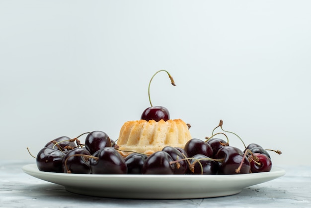 Free Photo a top view yummy cake with cherries inside plate cookie sugar  fruit biscuit