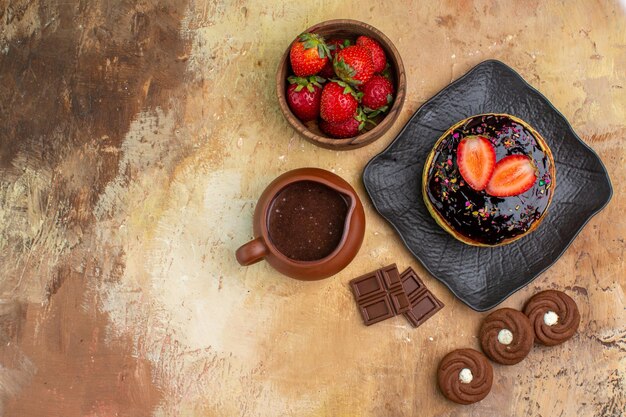 Top view yummy pancakes with cookies and fruits on wooden desk