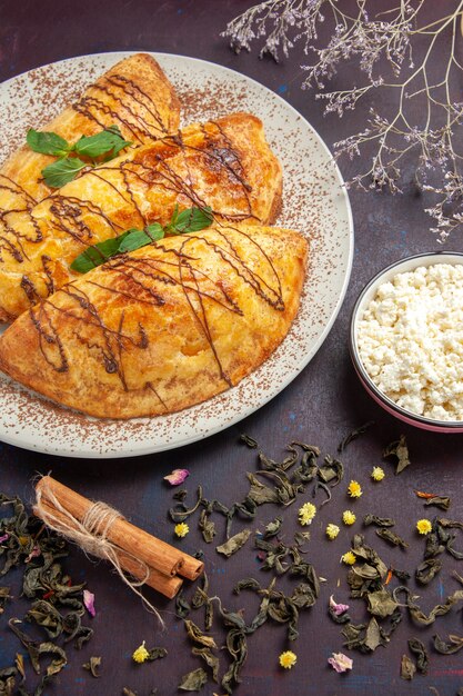 Top view yummy pastries with cottage cheese on dark background pastry sweet bake tea cake sugar cookie