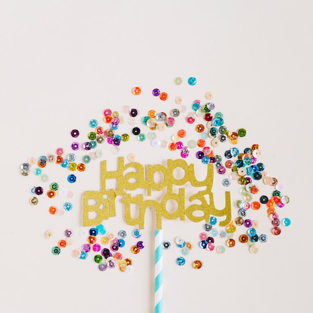 Free photo topper surrounded by colorful sequins