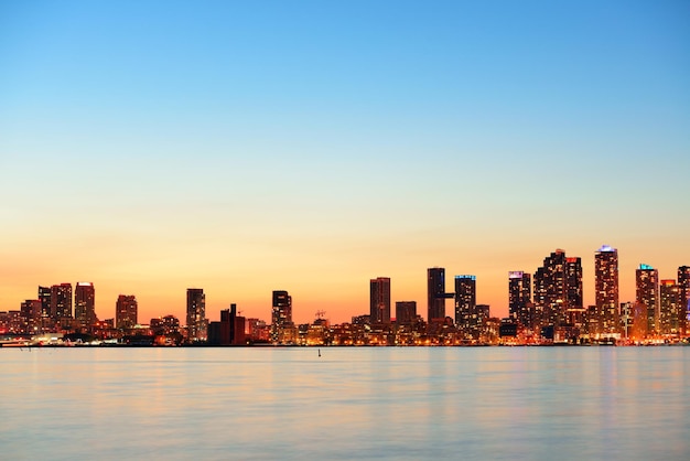 Free photo toronto cityscape panorama at dusk over lake with colorful light.