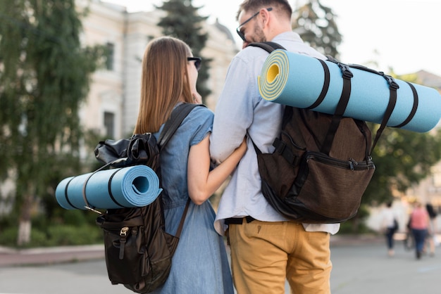 Free Photo tourist couple outdoors with backpacks