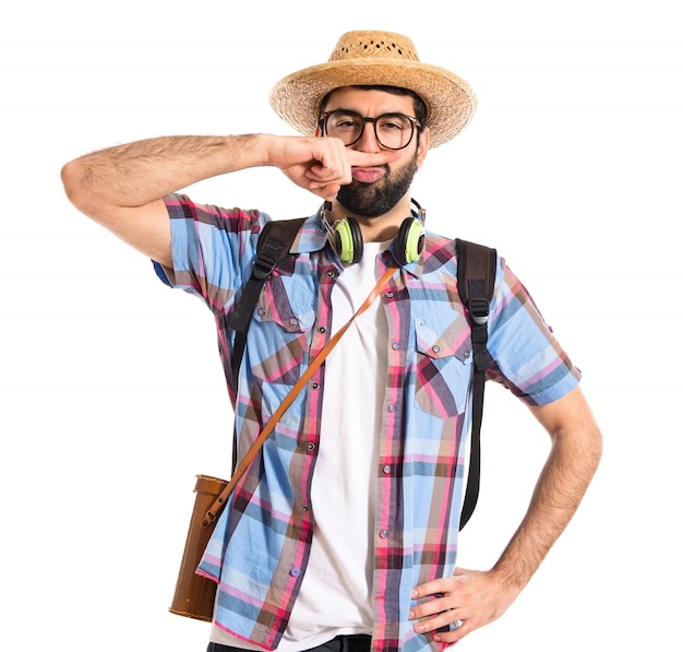 Tourist doing moustache sign