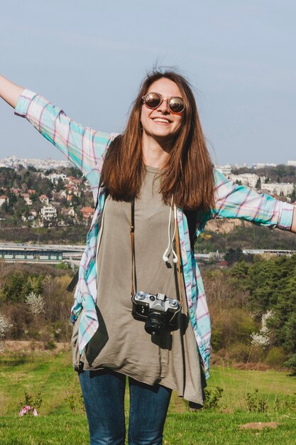 Tourist girl stretching arms