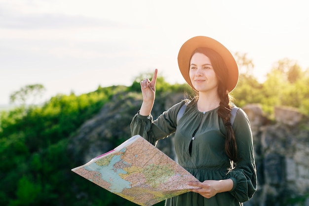 Tourist navigating in rocky landscape