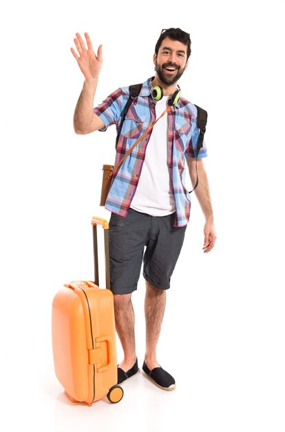 Tourist saluting over white background