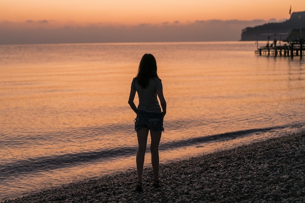 Tourist at the sunrise enjoying the view