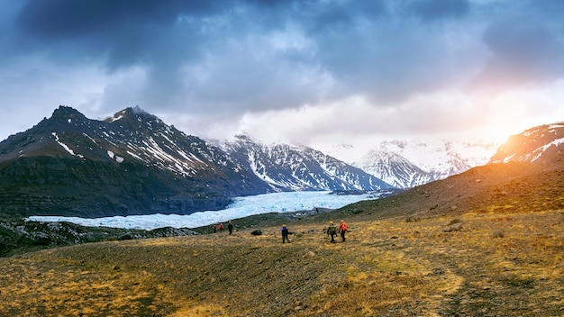 Tourist taking in Skaftafell glacier, Vatnajokull National Park in Iceland.