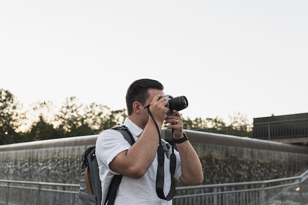 Tourist with a camera taking pictures