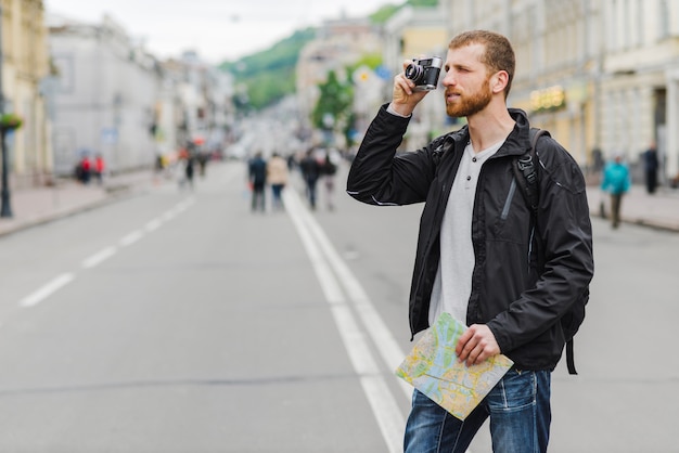 Tourist with map and camera