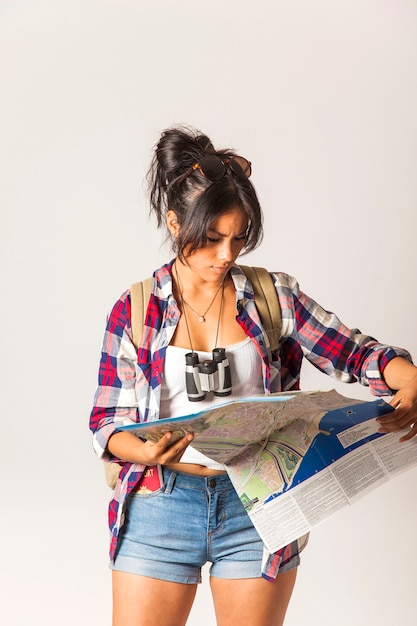 Free photo tourist woman looking at map