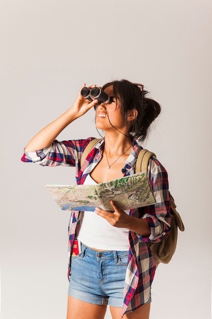 Free Photo tourist woman with binoculars