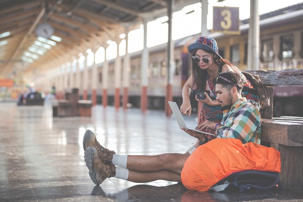 Tourists, couples looking at tablets to find attractions.