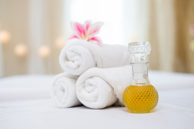 Free photo towel with spa oil for spa setting