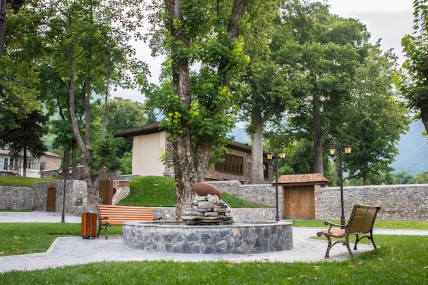 Town park with benches and fireplace.