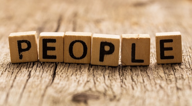 Toy bricks on the table with word people