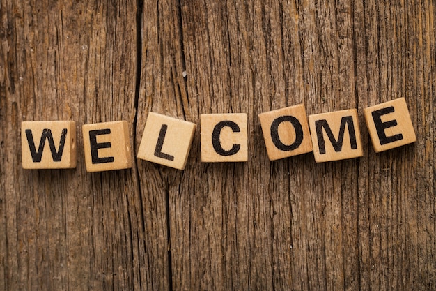 Toy bricks on the table with word welcome