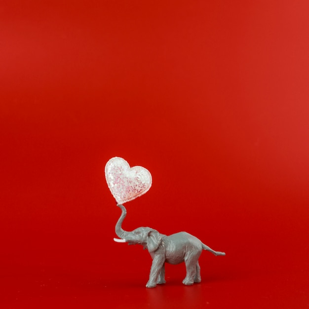 Free photo toy grey elephant with heart