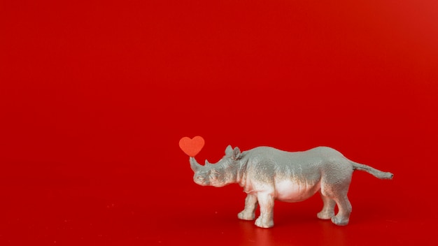 Free Photo toy grey rhinoceros with heart