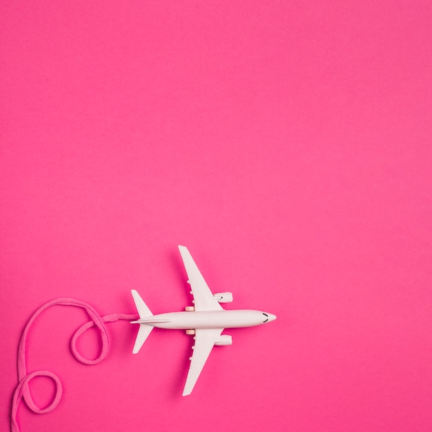 Toy plane with pink lace