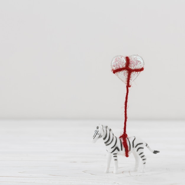 Free Photo toy zebra with balloon heart on twist