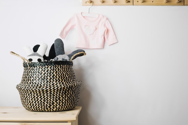 Toys in basket and baby T-shirt