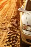 Free photo trace of wheels and car on a road