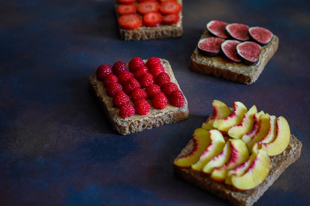 Traditional American and European summer breakfast: sandwiches of toast with peanut butter, copy  top view