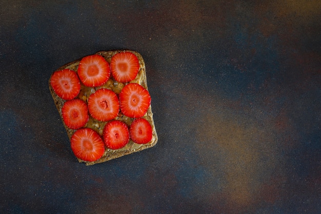 Free photo traditional american and european summer breakfast: sandwiches of toast with peanut butter, copy  top view