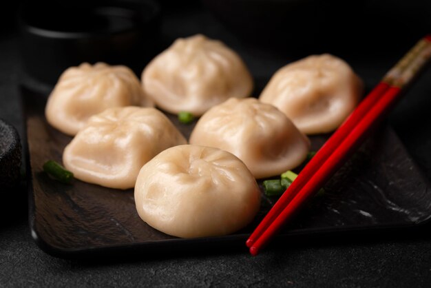 Traditional asian dumplings with chopsticks