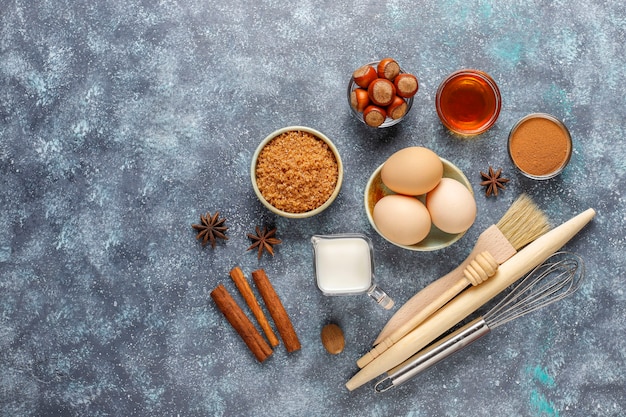 Free photo traditional autumn baking ingredients: apples,cinnamon,nuts.