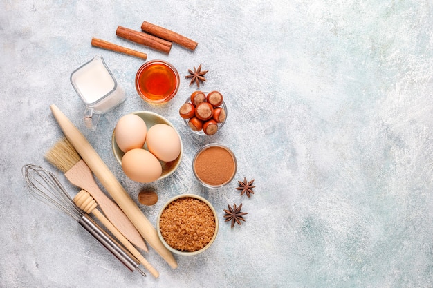 Free Photo traditional autumn baking ingredients: apples,cinnamon,nuts.