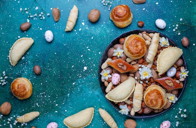 Traditional Azerbaijan holiday Novruz cookies baklavas and shakarburas on black tray plate 