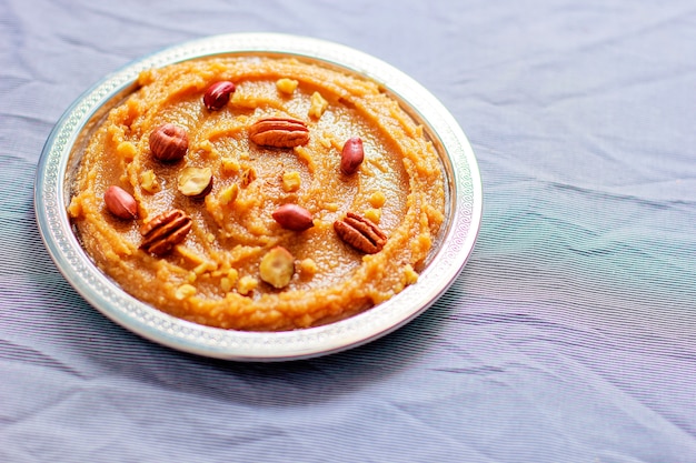 Free photo traditional azerbaijan, indian, turkish sweet dessert halvah with nuts on top