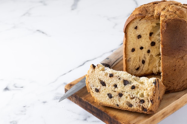 Traditional Christmas panettone on white marble