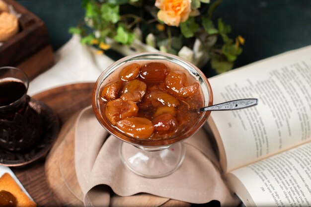 Traditional fig confiture with a glass of tea.