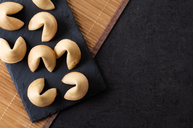 Traditional fortune cookies black slate backgroundxA