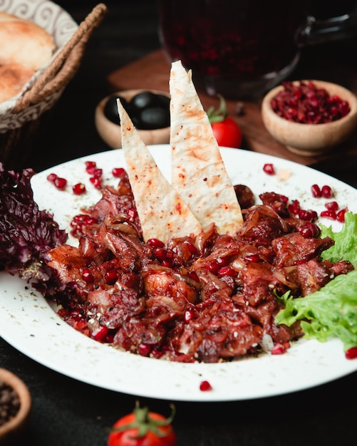 traditional fried meat with pomegranate and lavash