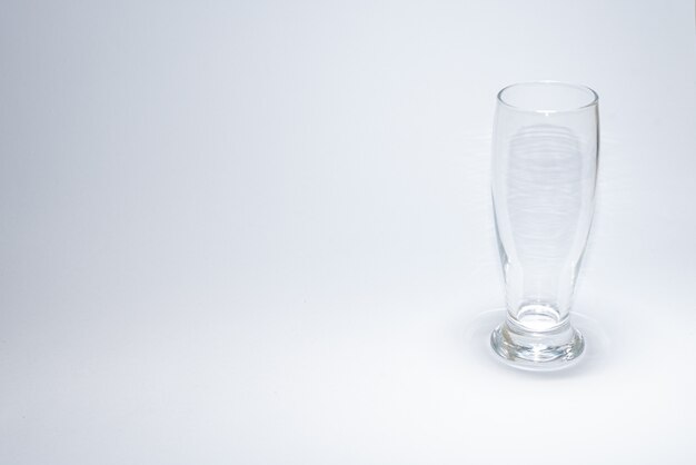 Traditional glass cup over white surface